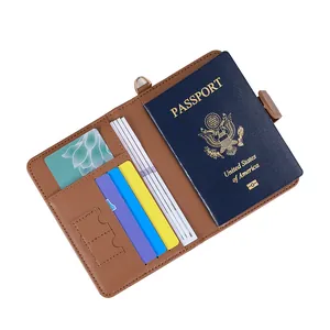 Brown leather passport wallet holder with card slots and a secure metal buckle strap
