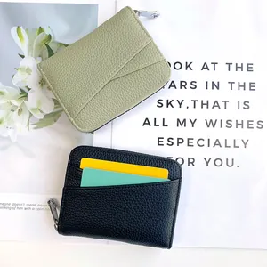 Minimalist accordion card holder purse in green and black with lychee texture leather