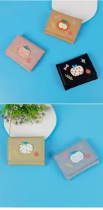 Detailed view of five colorful litchi grain tri-fold wallets with cute apple embroidery