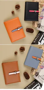 Close-up of stylish lychee texture faux leather passport wallets in four contrast colors