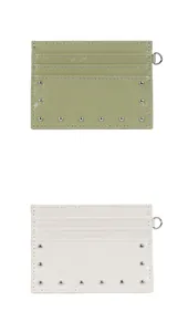 Detail of rivet trim and glossy wrinkled leather on olive and cream card holders