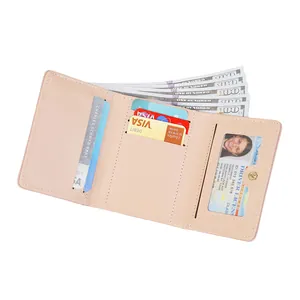 Three-fold light pink faux leather wallet featuring multiple card slots and an ID window