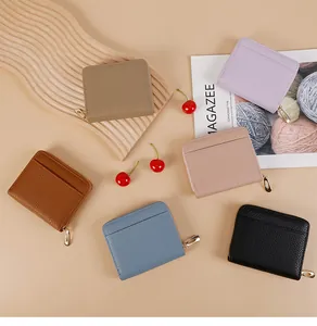 Litchi pattern leather wallet detail showing rear card slot and gold zipper in multiple colors