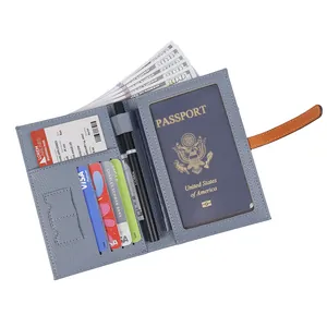Blue lychee leather travel passport holder with orange buckle and multi-slot interior