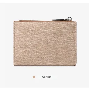 Detail of apricot zipper wallet showing durable twill texture and neat stitching
