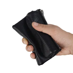 Portefeuille femme en cuir noir souple avec fermeture éclair et texture grainée