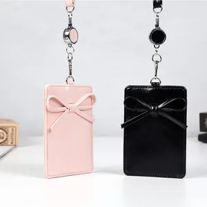 Porta badge retrattile con fiocco decorativo e cordino abbinato in rosa e nero