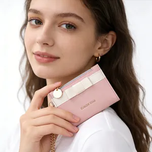 Pink minimalist macaron bow wallet with Classic Star logo and gold chain for women