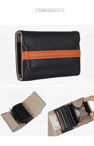 Detail view of black pebble leather accordion wallet with multi-card slots and coin pocket
