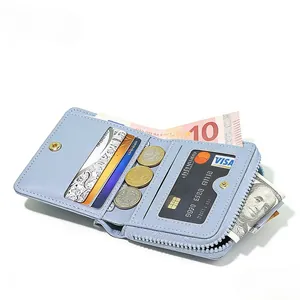 Slim light blue denim-textured bifold wallet with multi-card slots and a zipper pocket