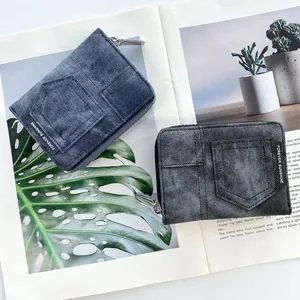 Detail of blue and black denim wallets with Forever Sunshine tags on a magazine
