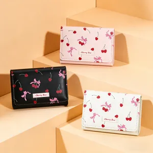 Three colors of short wallets with cherry and bow prints on synthetic PU leather