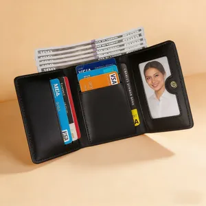 Three-fold black leather wallet with cherry bow print showing card slots and cash pocket