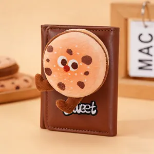 Close-up of brown PU leather wallet featuring 3D plush cookie design with sweet embroidery