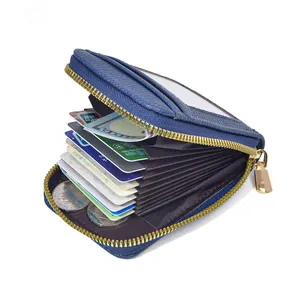 Detail view of blue lychee grain leather card holder with accordion slots and gold zipper
