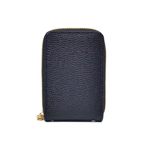 Close-up of black litchi grain leather card holder wallet with a gold metal zipper