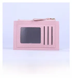 Rear view of pink slim card wallet showing ID window, slots, and metal zipper pocket