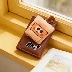 Close-up of brown leather wallet with cute plush milk tea patch and Nice embroidery