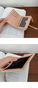 Detail view of pink PU leather wallet showing card slots, ID window and zipper coin pocket