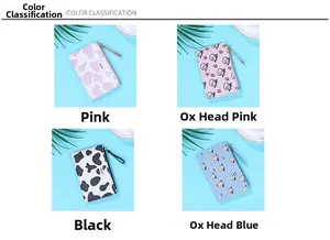 Detail of cute cow pattern slim wallets with card slots and top zippers in multiple colors