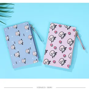 Close-up of cute cow pattern PU leather coin purses with zipper and hand straps