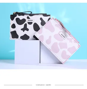 Detail of cute cow pattern PU leather small coin purses with zipper and Milk embroidery