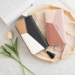 Portefeuille long en cuir PU pour femme avec design géométrique et pompon décoratif