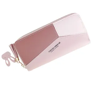 Portefeuille long pour femme en similicuir rose avec pompon et breloque lapin