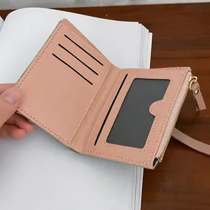 Short bi-fold PU leather wallet with multiple card slots and zipper coin pocket in beige pink