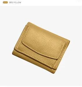Detailed view of yellow lychee pattern leather wallet with fine stitching