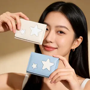 Minimalist cartoon star trifold wallets in beige and blue held by a fashion model
