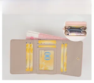 Detail view of compact tri-fold wallet showing multiple card slots and zippered coin pocket