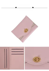 Detail of pink leather tri-fold wallet showing card slots and gold turn-lock closure