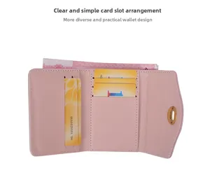 Detail view of pink tri-fold wallet with multiple card slots and gold metal twist lock