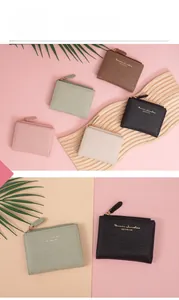 Close-up of retro crocodile texture zip wallets in pink, green, brown and cream colors