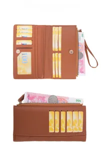 Detail view of brown quilted faux leather wallet with card slots and zipper compartment