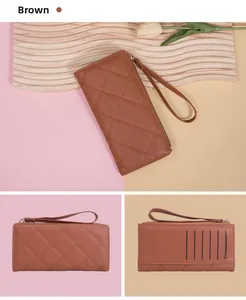 Detailed macro view of quilted brown long leather wallet featuring rear card slots and wrist strap