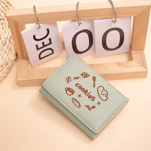 Portefeuille femme vert menthe à trois volets avec broderies de biscuits et café