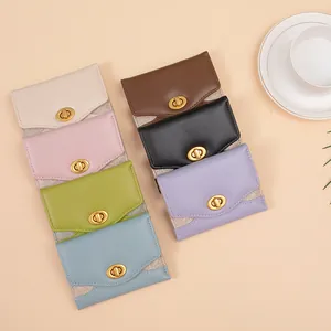 Elegant mini tri-fold wallets in six colors with gold twist locks and glitter side panels