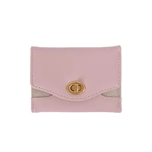 Pink PU leather trifold wallet with gold turn-lock closure and glitter side panels
