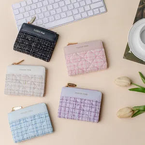 Short women wallet set in five pastel colors with tweed texture and gold zipper details