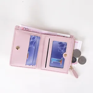 Petit portefeuille rose brodé pour femme avec fentes pour cartes et poche zippée dorée