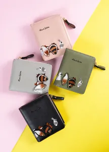 Detail of multi-color PU leather coin purses with animal embroidery and zip closure