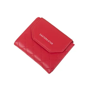 Red quilted faux leather trifold short wallet with snap button and white letter print