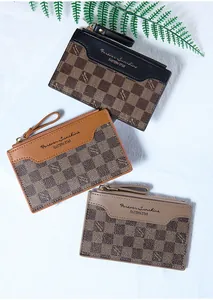 Detailed view of the zip coin purses in black, caramel and taupe with checkerboard pattern