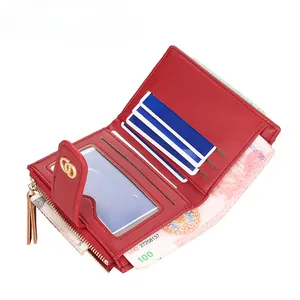 Red quilted leather compact wallet with multi-card slots and gold metal buckle