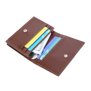 Minimalist brown leather fold wallet with card slots and metal snap closure for women
