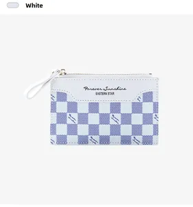Detail of blue checkerboard zipper card holder with leather wrist strap and secure zip