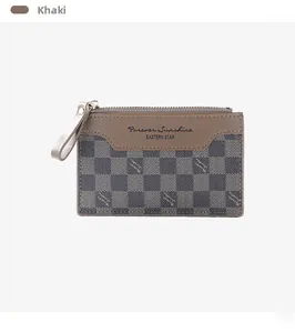 Close-up of khaki checkered wallet featuring leather detail and gold zipper puller