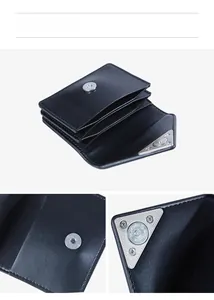 Detail view of black leather wallet showing the card slots and silver metal hardware